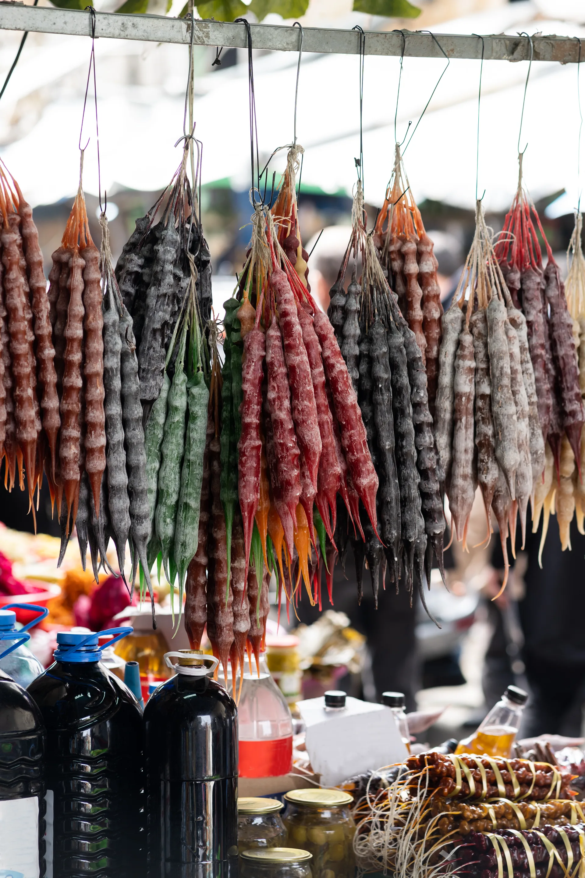 Various Georgian nut and dried fruit confections displayed at a market